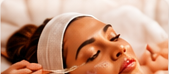 Artist applying complexion makeup during skin prep