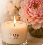 LMB candle with floral arrangement